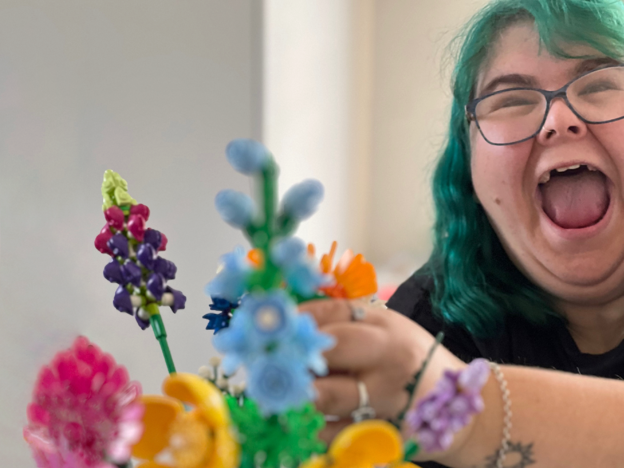 Picture of Happy TLC Participant Erin with Flowers in the Table