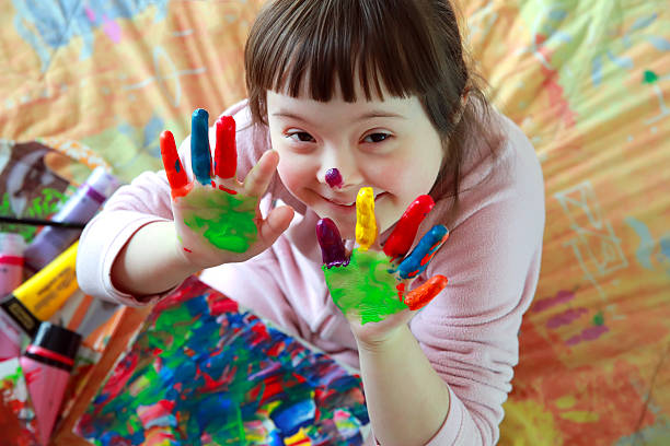 Picture of Happy TLC Participant Erin with Flowers in the Table